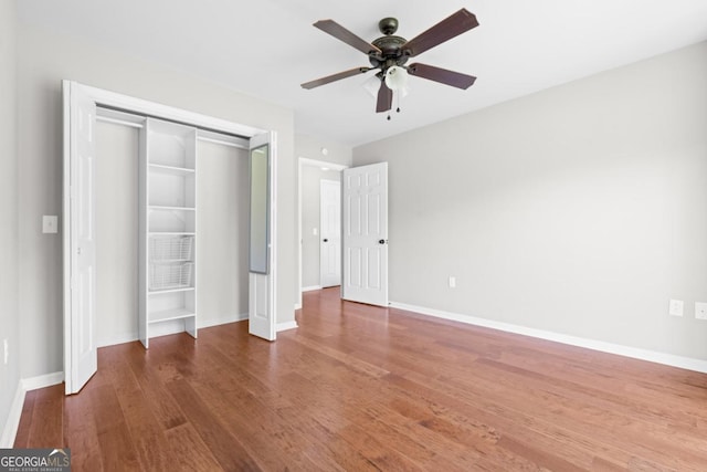 1501 Cayla Way, Statesboro, GA 30458 - unfurnished bedroom with wood finished floors, a closet, and ceiling fan