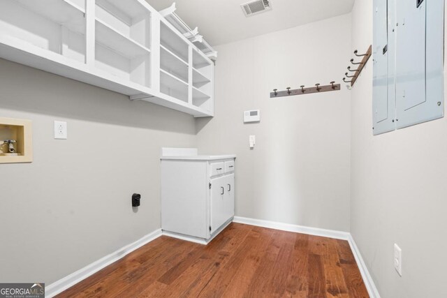 1501 Cayla Way, Statesboro, GA 30458 - washroom featuring electric panel, washer hookup, and dark wood-style flooring