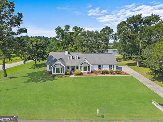 1501 Cayla Way, Statesboro, GA 30458 - view of front facade featuring a front yard, a water view, driveway, and a chimney