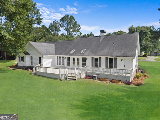 1501 Cayla Way, Statesboro, GA 30458 - back of property featuring a yard, a shingled roof, a chimney, and a wooden deck