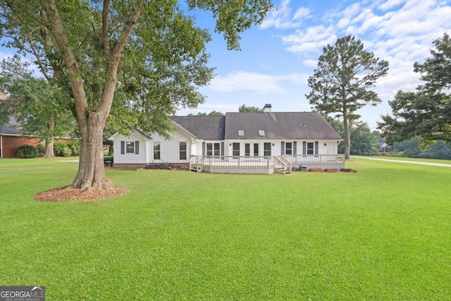 1501 Cayla Way, Statesboro, GA 30458 - rear view of house with a deck, a lawn, and a chimney