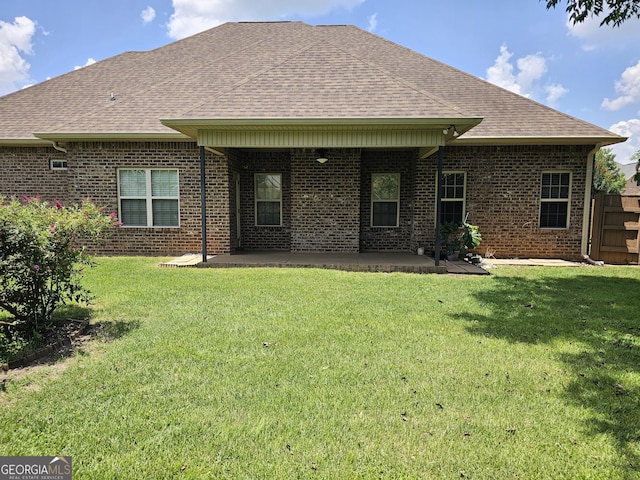 303 Norfolk Cir, Warner Robins, GA 31088 - back of house with brick siding, roof with shingles, and a patio