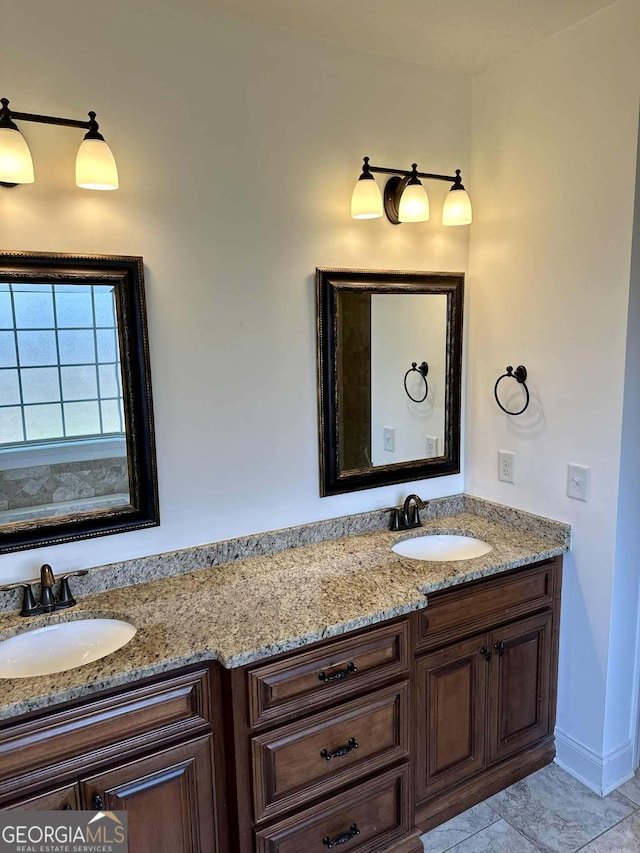 303 Norfolk Cir, Warner Robins, GA 31088 - full bathroom featuring double vanity and baseboards