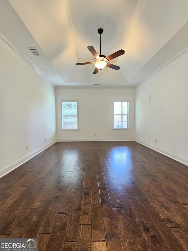 303 Norfolk Cir, Warner Robins, GA 31088 - empty room featuring a raised ceiling, dark wood-style flooring, ceiling fan, and ornamental molding