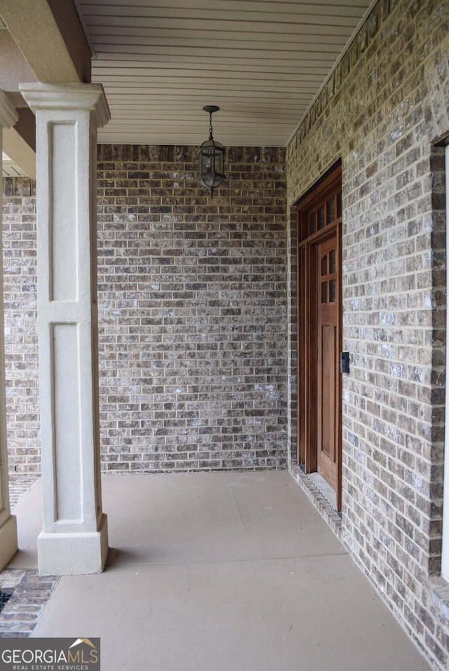 303 Norfolk Cir, Warner Robins, GA 31088 - property entrance with brick siding and covered porch