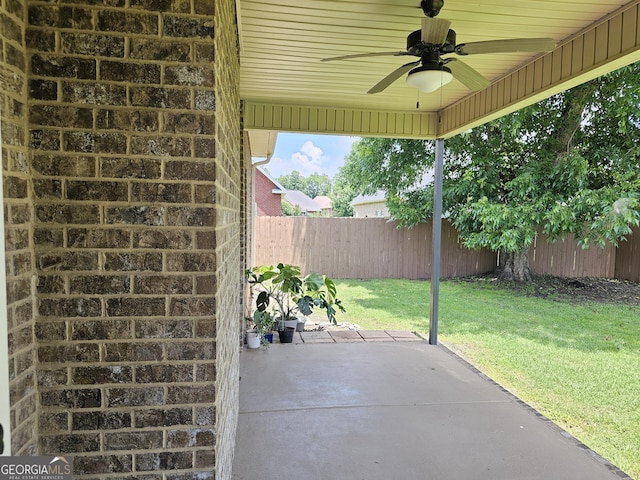 303 Norfolk Cir, Warner Robins, GA 31088 - fenced backyard featuring ceiling fan and a patio