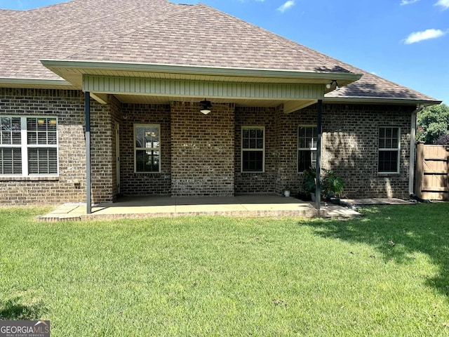 303 Norfolk Cir, Warner Robins, GA 31088 - back of property with a shingled roof, a patio, a ceiling fan, and brick siding