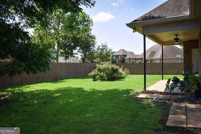303 Norfolk Cir, Warner Robins, GA 31088 - fenced backyard featuring a ceiling fan and a patio