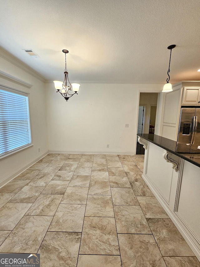 303 Norfolk Cir, Warner Robins, GA 31088 - unfurnished dining area featuring a chandelier and crown molding