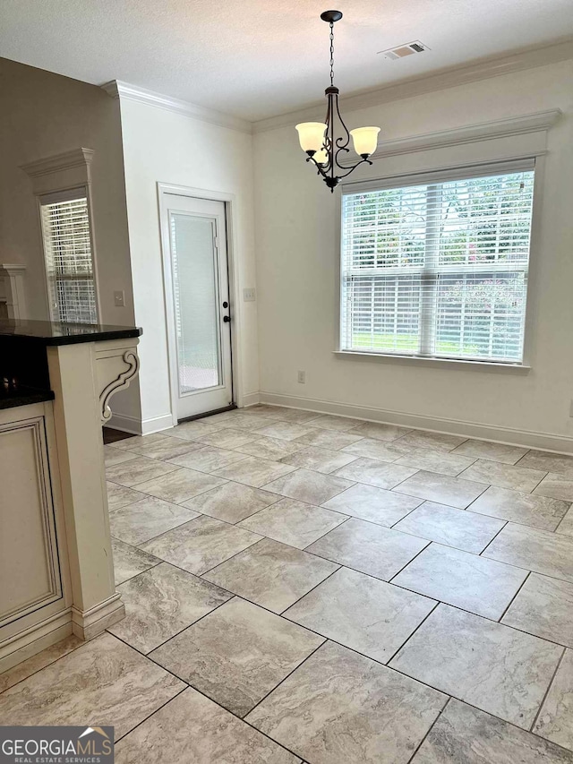 303 Norfolk Cir, Warner Robins, GA 31088 - unfurnished dining area with a chandelier and crown molding