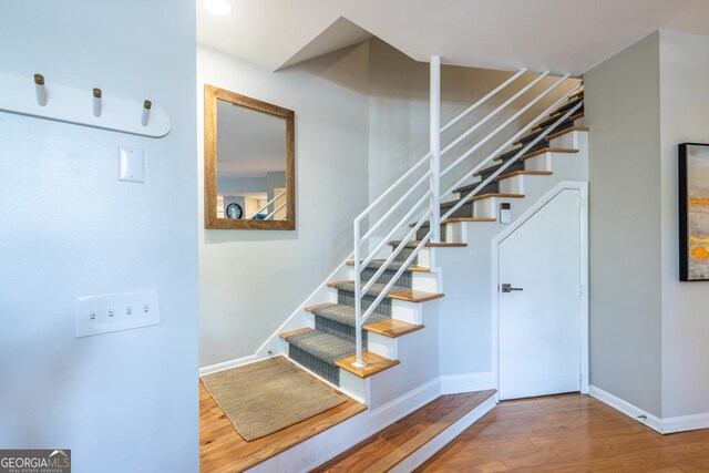 1192 Cleburne Ave NE, Atlanta, GA 30307 - stairs featuring wood finished floors and recessed lighting