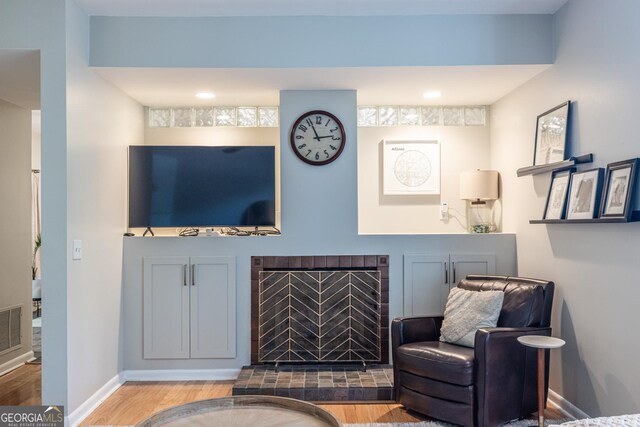 1192 Cleburne Ave NE, Atlanta, GA 30307 - living room with wood finished floors and a tile fireplace
