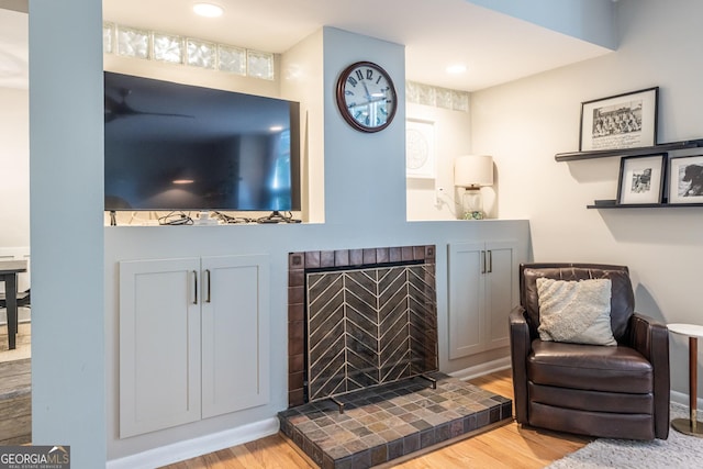 1192 Cleburne Ave NE, Atlanta, GA 30307 - sitting room featuring wood finished floors and a tile fireplace