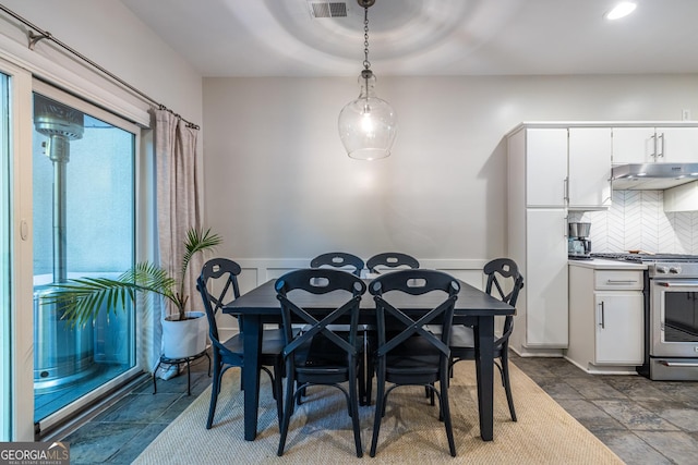 1192 Cleburne Ave NE, Atlanta, GA 30307 - dining room with wainscoting, dark stone finish flooring, and recessed lighting