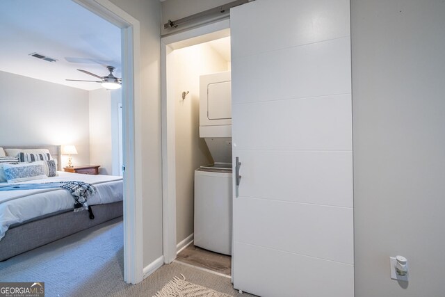 1192 Cleburne Ave NE, Atlanta, GA 30307 - laundry room featuring estacked washer and dryer, light carpet, and ceiling fan