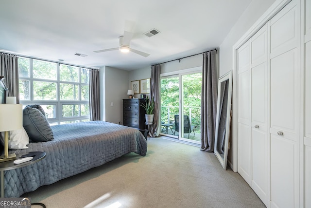 1192 Cleburne Ave NE, Atlanta, GA 30307 - bedroom featuring light carpet, access to exterior, ceiling fan, and a closet
