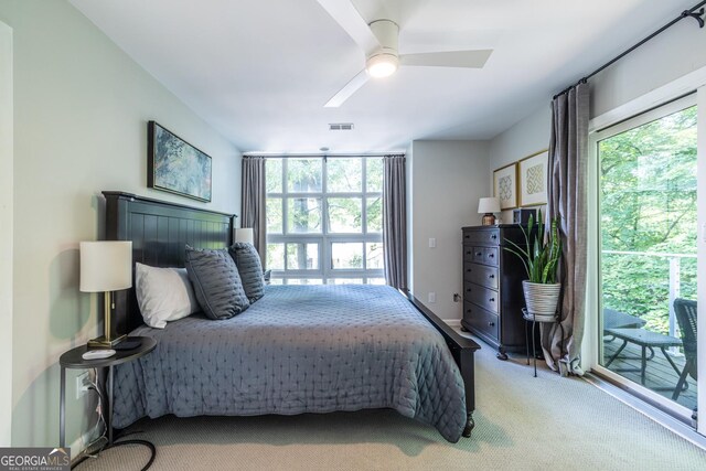 1192 Cleburne Ave NE, Atlanta, GA 30307 - bedroom featuring multiple windows, light carpet, access to exterior, and ceiling fan