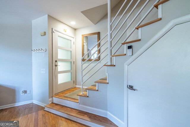 1192 Cleburne Ave NE, Atlanta, GA 30307 - entryway with wood finished floors, stairway, and recessed lighting
