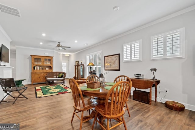 1290 Starboard Way, Greensboro, GA 30642 - dining area featuring crown molding, ceiling fan, light wood-type flooring, and recessed lighting