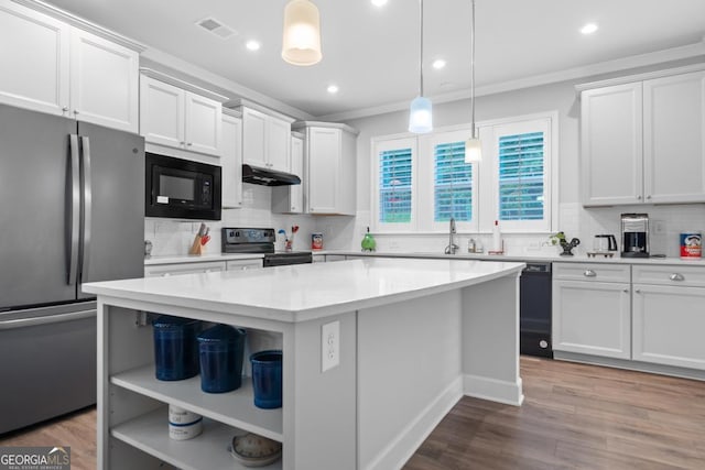 1290 Starboard Way, Greensboro, GA 30642 - kitchen with black appliances, under cabinet range hood, ornamental molding, a center island, and decorative backsplash