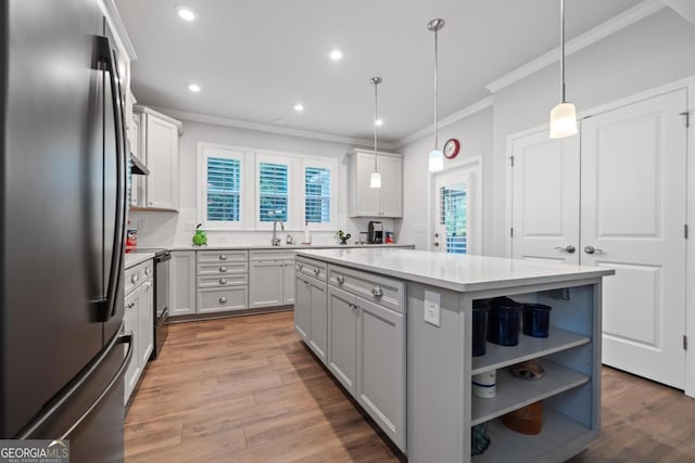 1290 Starboard Way, Greensboro, GA 30642 - kitchen with freestanding refrigerator, crown molding, light countertops, a kitchen island, and open shelves