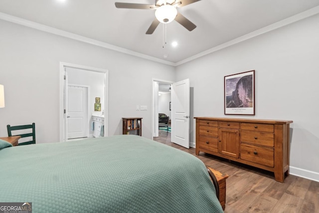 1290 Starboard Way, Greensboro, GA 30642 - bedroom featuring wood finished floors, ornamental molding, ensuite bathroom, ceiling fan, and recessed lighting