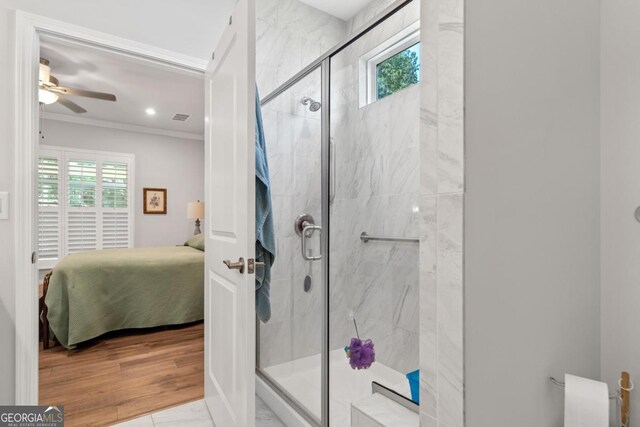 1290 Starboard Way, Greensboro, GA 30642 - bathroom featuring ensuite bathroom, plenty of natural light, crown molding, a marble finish shower, and ceiling fan