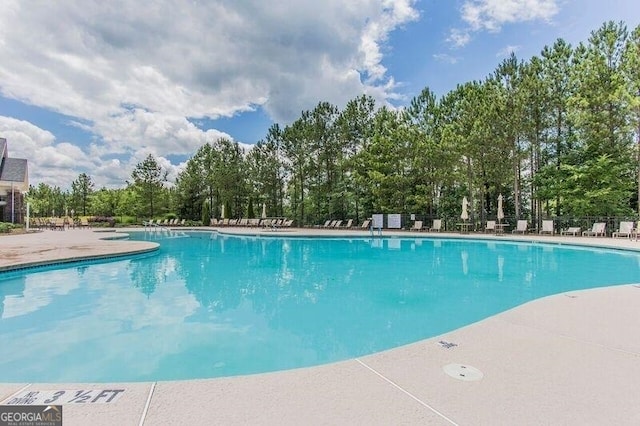 1290 Starboard Way, Greensboro, GA 30642 - community pool featuring view of scattered trees and a patio area