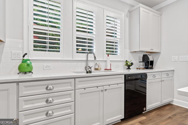 1290 Starboard Way, Greensboro, GA 30642 - kitchen with black dishwasher, tasteful backsplash, white cabinetry, and wood finished floors