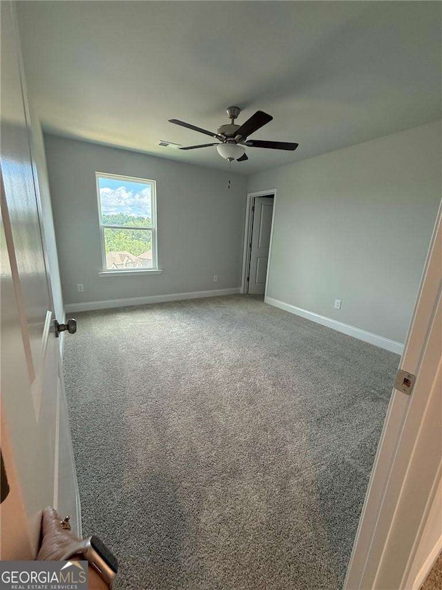4266 Azalea Ridge Way, Hoschton, GA 30548 - unfurnished bedroom featuring carpet flooring and a ceiling fan