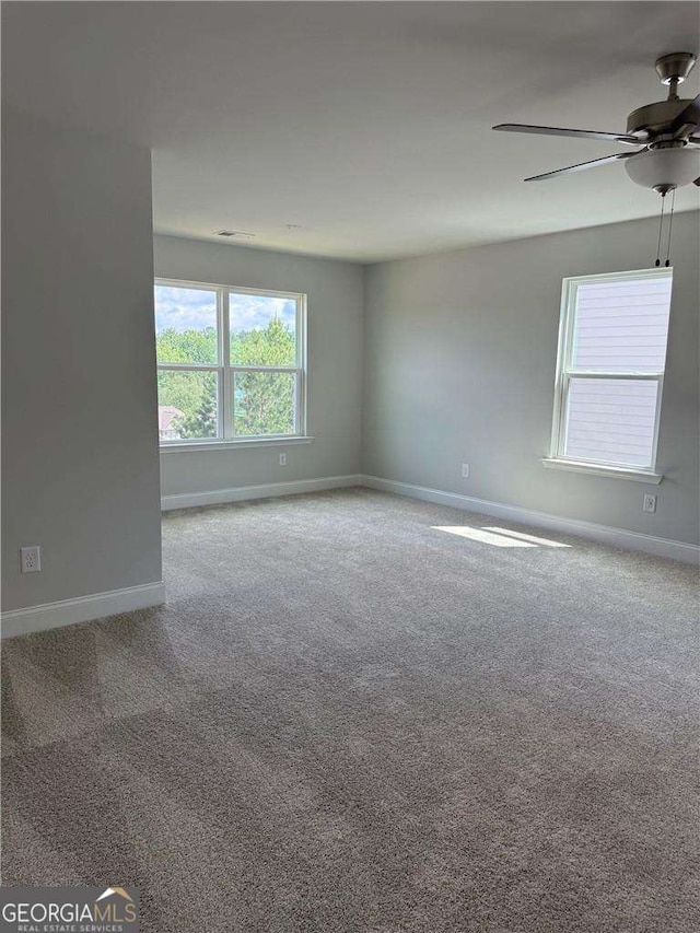 4266 Azalea Ridge Way, Hoschton, GA 30548 - carpeted empty room with baseboards and ceiling fan