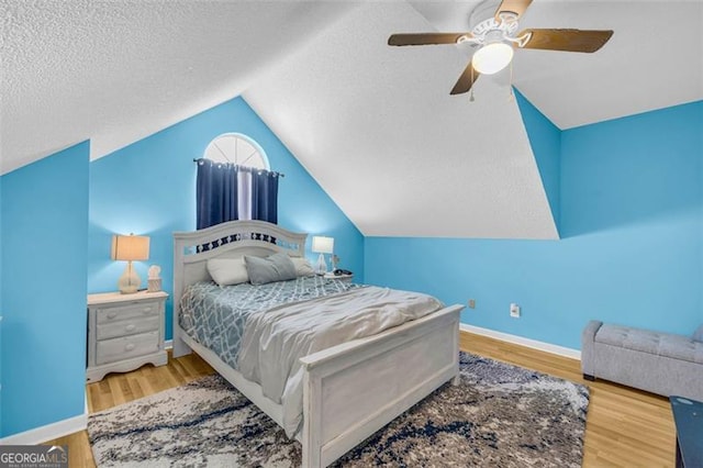 6178 Field Stone, Douglasville, GA 30134 - bedroom with lofted ceiling, wood finished floors, ceiling fan, and a textured ceiling