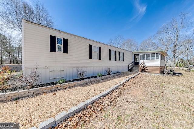 281 Jones Rd, Jefferson, GA 30549 - manufactured / mobile home with a sunroom