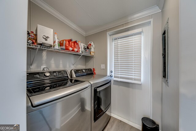 281 Jones Rd, Jefferson, GA 30549 - washroom with washing machine and dryer, crown molding, and light wood-type flooring