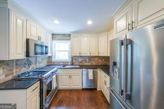9805 Buice Rd, Alpharetta, GA 30022 - kitchen featuring premium appliances, dark wood finished floors, decorative backsplash, crown molding, and recessed lighting