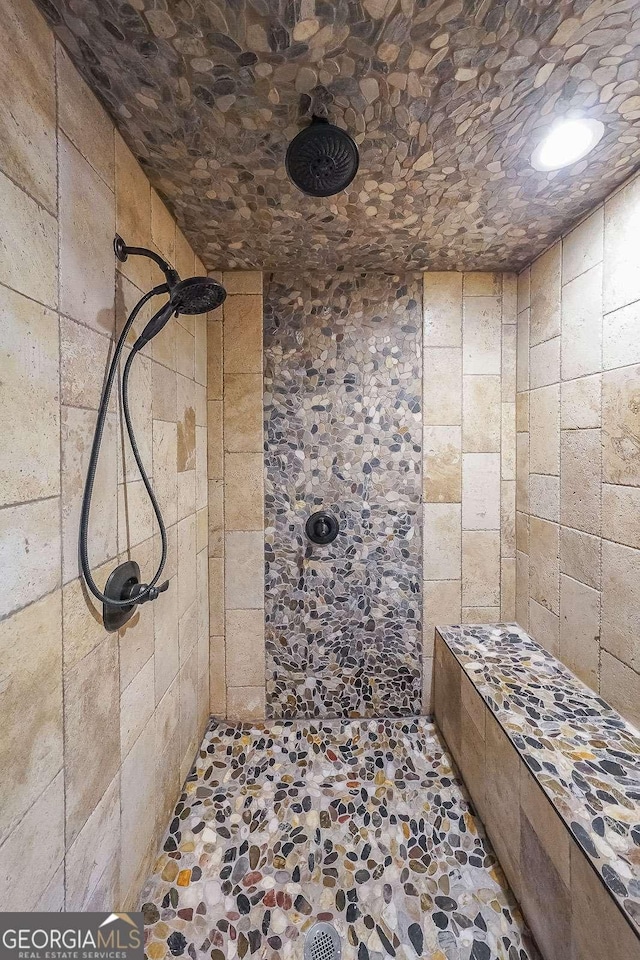 9805 Buice Rd, Alpharetta, GA 30022 - bathroom with stone flooring and tiled shower