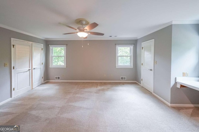 9805 Buice Rd, Alpharetta, GA 30022 - empty room with ornamental molding, plenty of natural light, ceiling fan, and light carpet