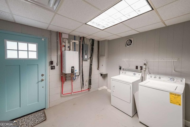 9805 Buice Rd, Alpharetta, GA 30022 - laundry room featuring washing machine and clothes dryer, electric panel, and tankless water heater