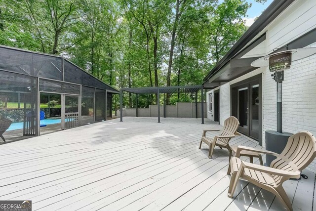 9805 Buice Rd, Alpharetta, GA 30022 - deck with an outdoor pool, a lanai, and french doors