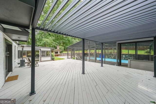 9805 Buice Rd, Alpharetta, GA 30022 - wooden terrace with an outdoor pool and a sunroom