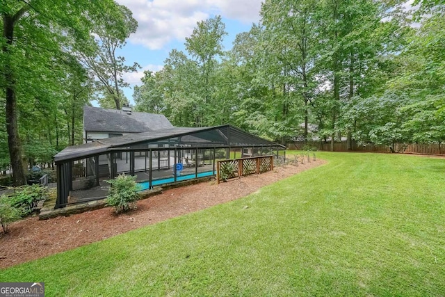 9805 Buice Rd, Alpharetta, GA 30022 - view of yard with a swimming pool and glass enclosure