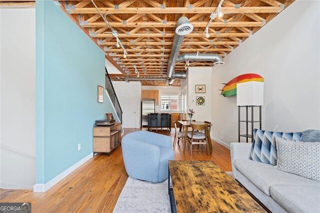 322 Peters Unit 2, Atlanta, GA 30313 - living room featuring baseboards and light wood-style floors