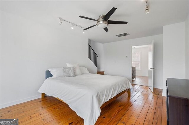 322 Peters Unit 2, Atlanta, GA 30313 - bedroom featuring track lighting, hardwood / wood-style floors, and a ceiling fan