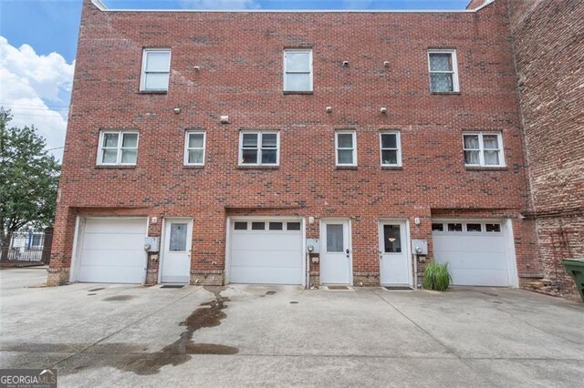 322 Peters Unit 2, Atlanta, GA 30313 - back of property with driveway, brick siding, and an attached garage