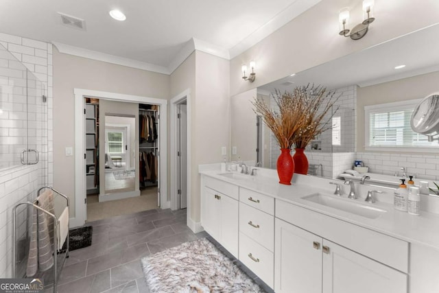 109 Bellehaven Dr, Woodstock, GA 30188 - full bathroom featuring crown molding, double vanity, a shower stall, recessed lighting, and a spacious closet