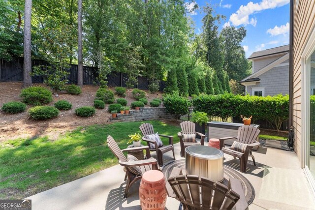 109 Bellehaven Dr, Woodstock, GA 30188 - fenced backyard featuring a patio and a fire pit