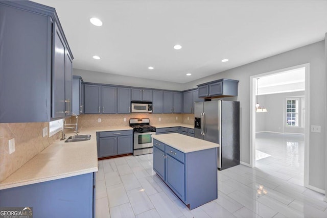 27 Spur Ct, Hiram, GA 30141 - kitchen with appliances with stainless steel finishes, light countertops, a kitchen island, tasteful backsplash, and recessed lighting