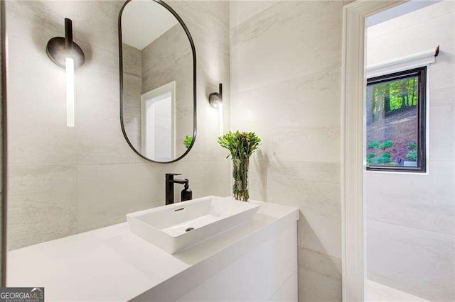 6090 River Chase Cir, Atlanta, GA 30328 - bathroom with vanity and tile walls
