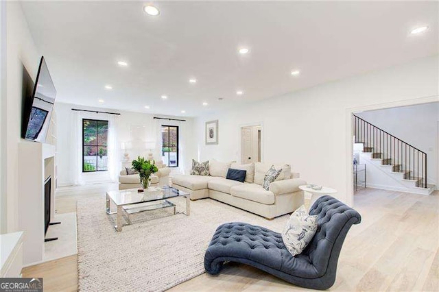 6090 River Chase Cir, Atlanta, GA 30328 - living room featuring stairs, light wood finished floors, and recessed lighting