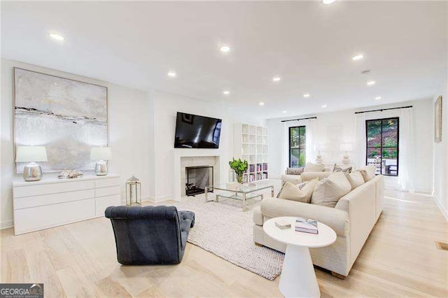 6090 River Chase Cir, Atlanta, GA 30328 - living area with recessed lighting, light wood-style floors, and a fireplace